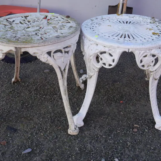 2 white metal stools