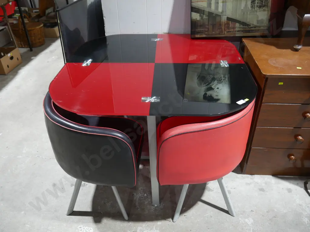 Red and black glass top table and four chairs Image 1++