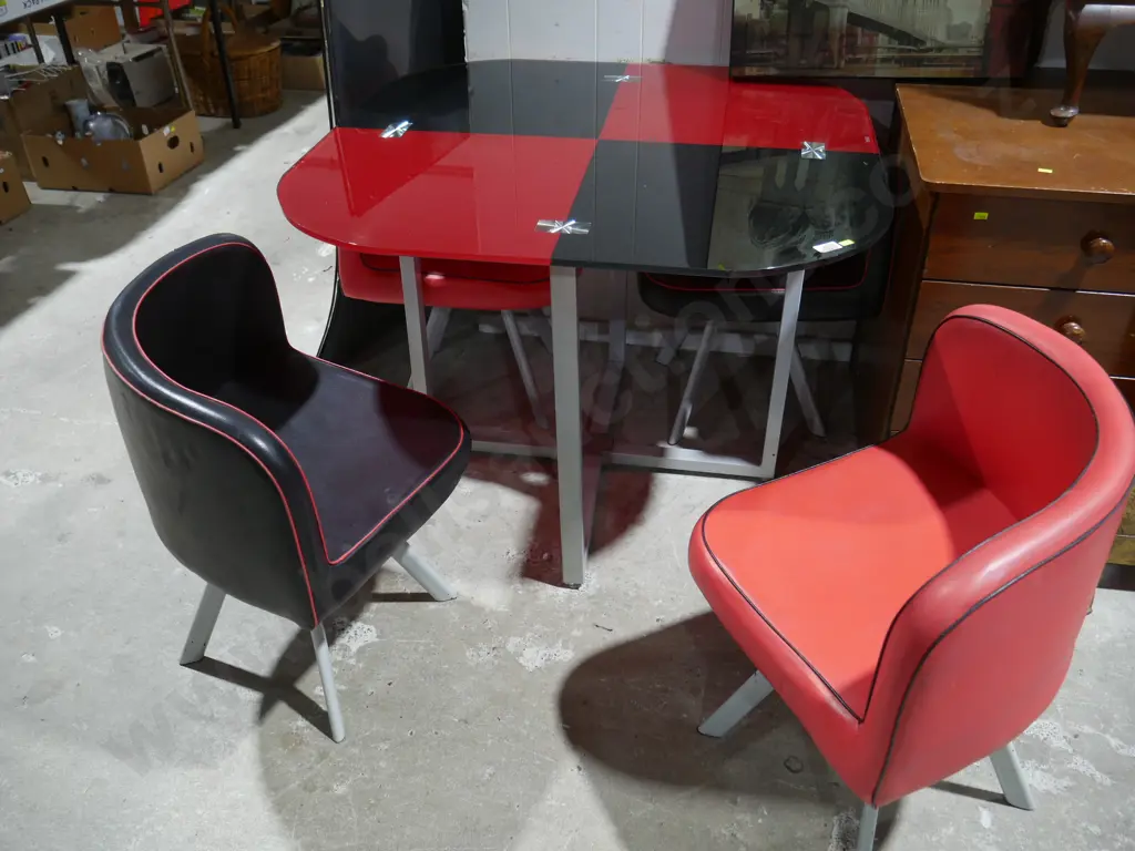 Red and black glass top table and four chairs Image 1++