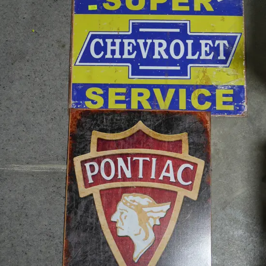 Two tin signs