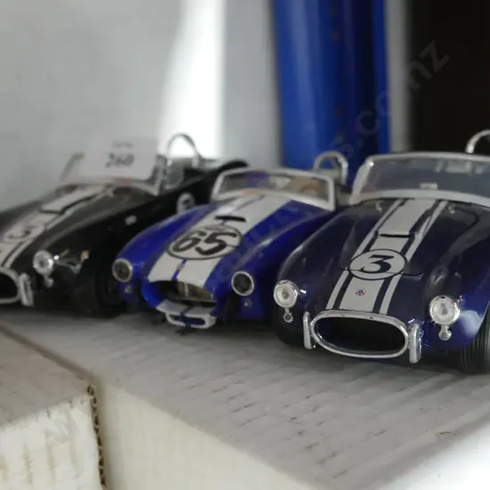 Three model race cars