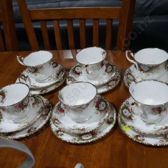 Set of six Royal Albert "Celebration" trios