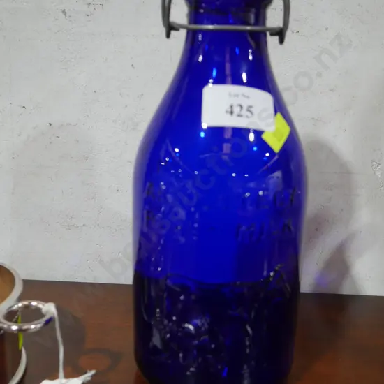 Blue glass milk bottle