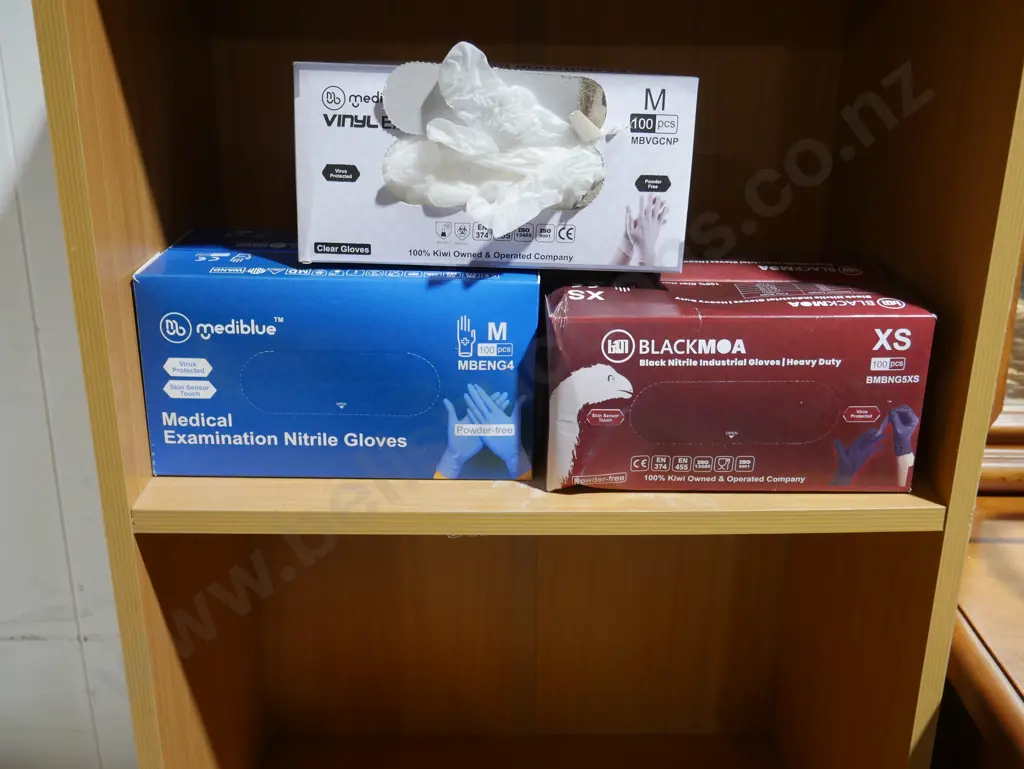 Boxes of vinyl gloves Image 1++