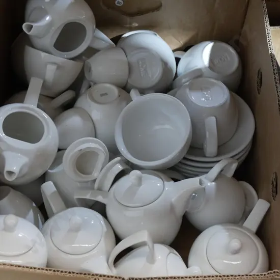 Teapots, cups and saucers
