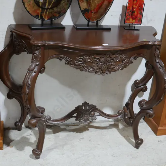 Ornate carved console table