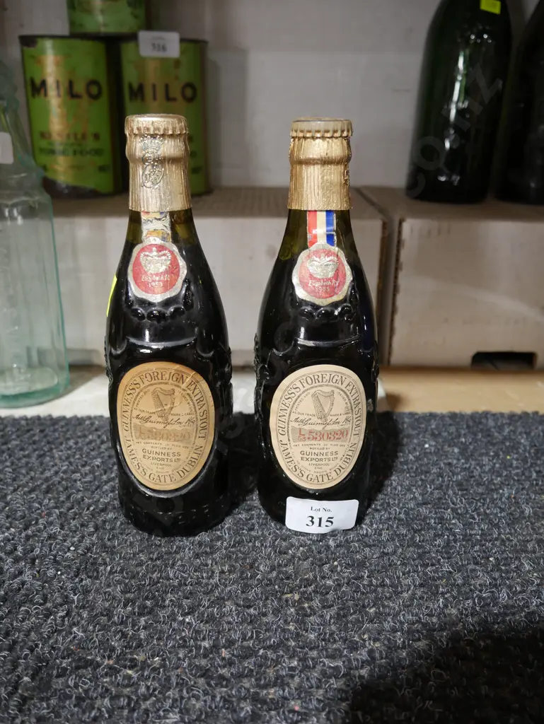 2 old Guinness bottles Image 1++