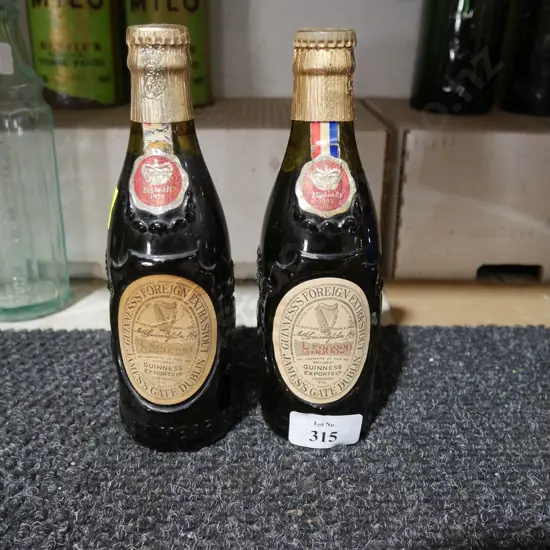 2 old Guinness bottles