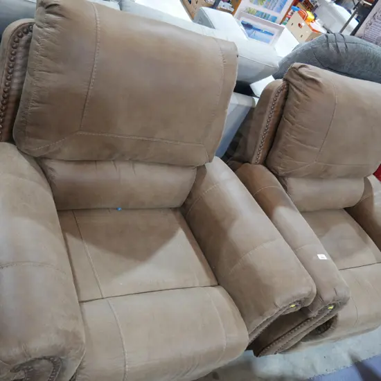 A pair of recliner easy chairs
