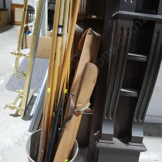 Pool cues and tin bucket