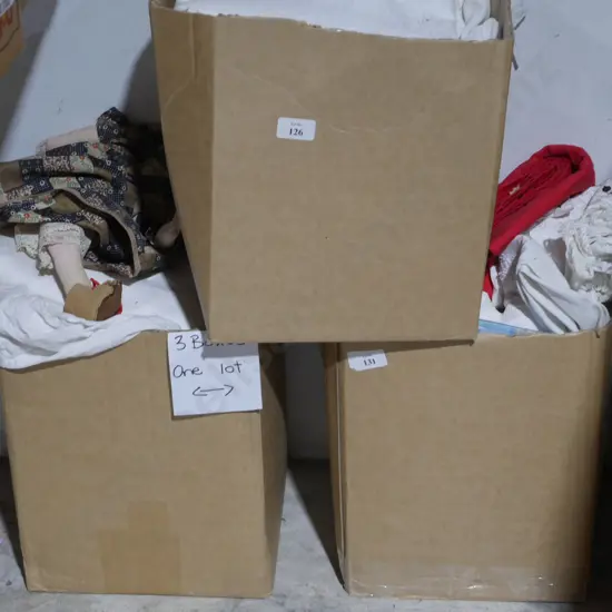 Three boxes of linen etc