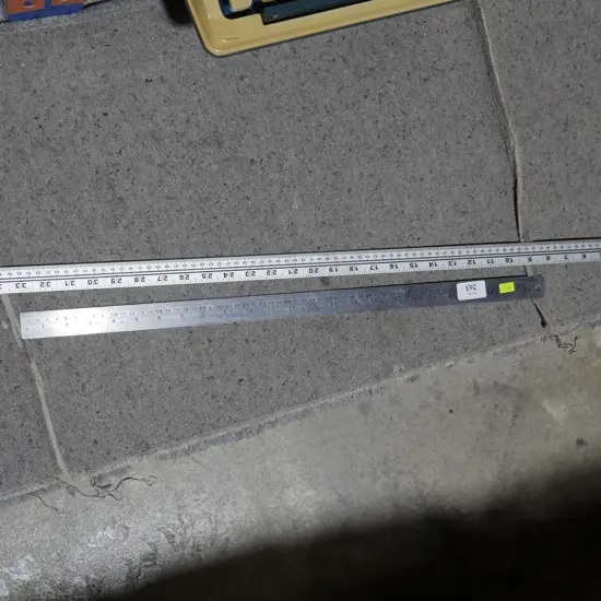 Two metal rulers