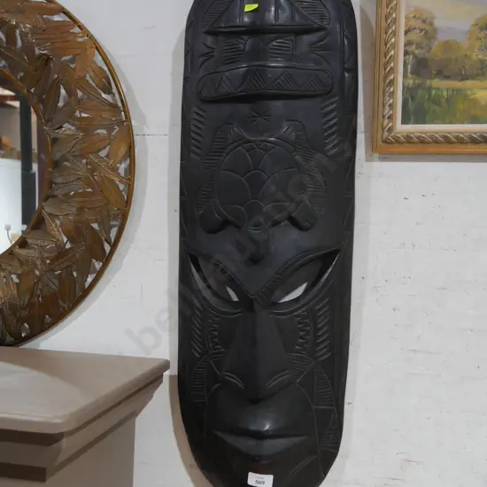Carved wooden wall mask