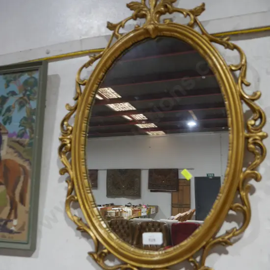 Ornate gilt framed mirror
