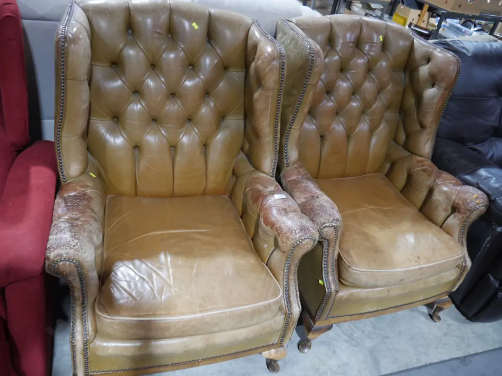 Pair of leather deep button armchairs Image 1++