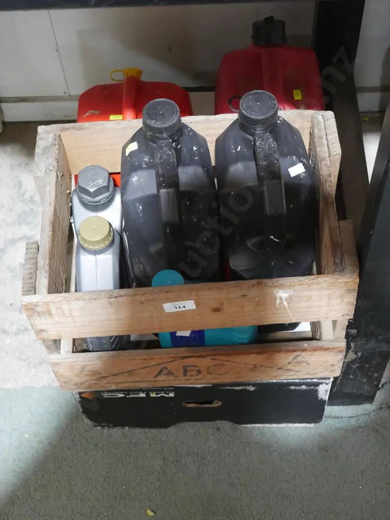 Assorted oils and petrol cans Image 1++
