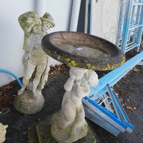 Concrete bird bath and garden statue