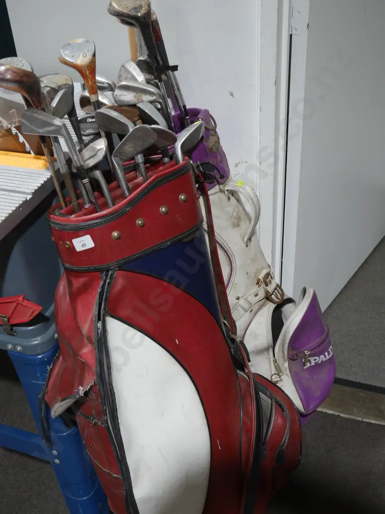 2 golf bags and clubs Image 1++