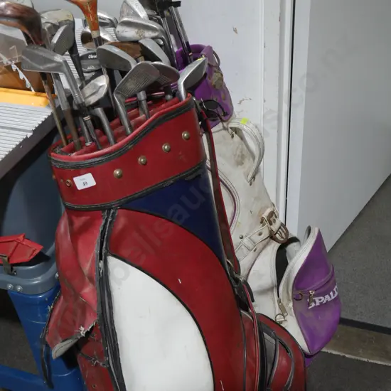 2 golf bags and clubs