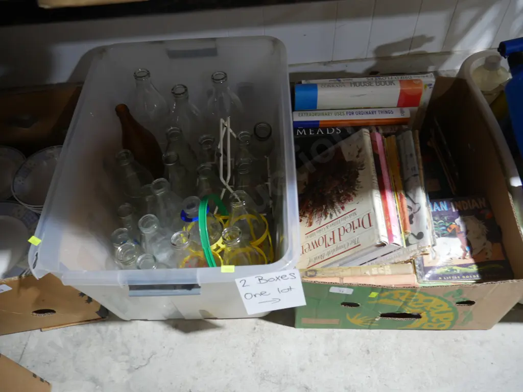 2 boxes of milk bottles and books Image 1++
