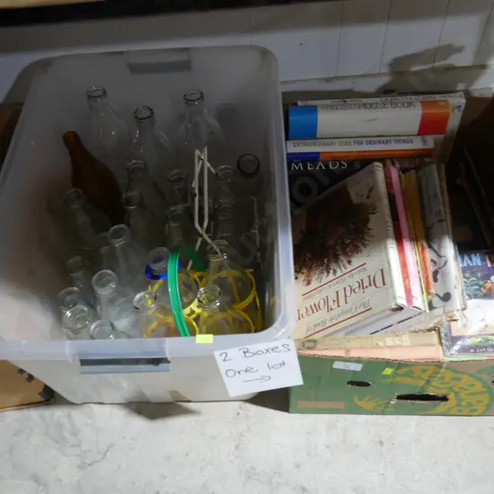 2 boxes of milk bottles and books