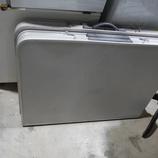 Two fold-up tables