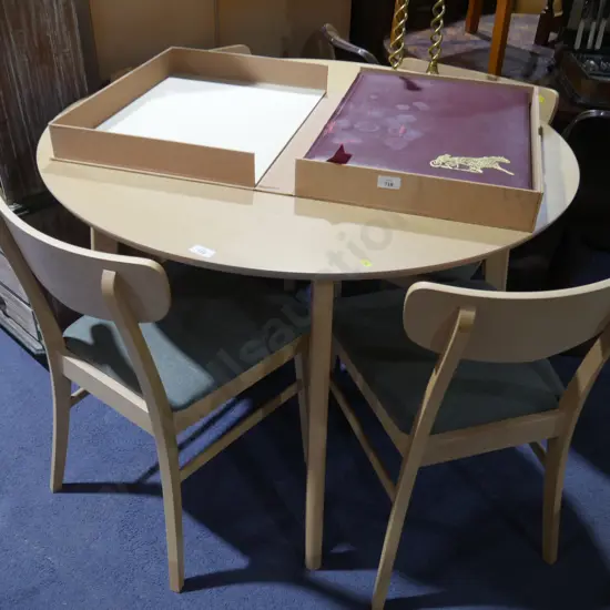 Round modern dining table and four chairs