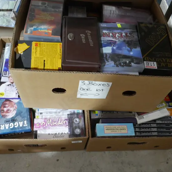 Three boxes of DVDs