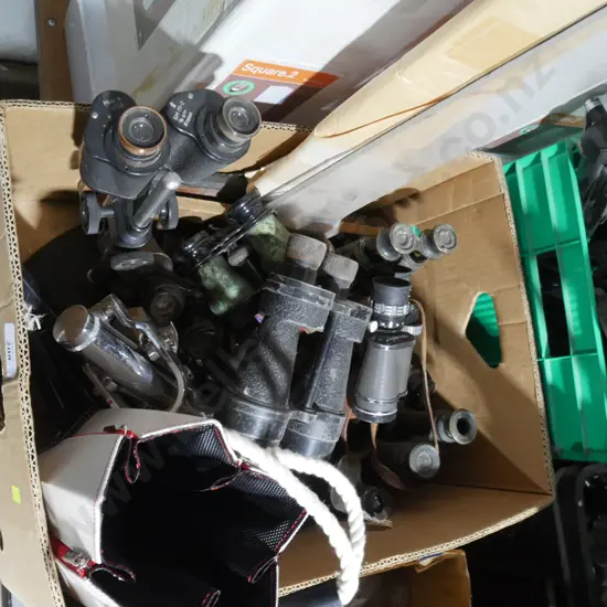 Assorted pairs of binoculars etc
