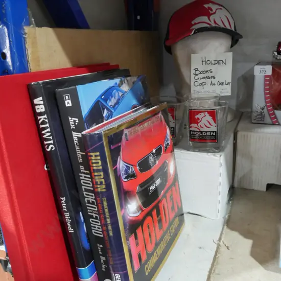 Holden books, glasses and hat