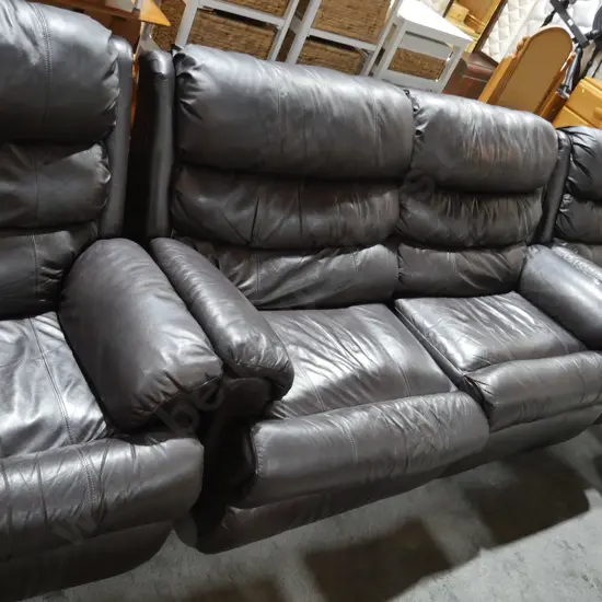 Three-piece brown leather lounge suite