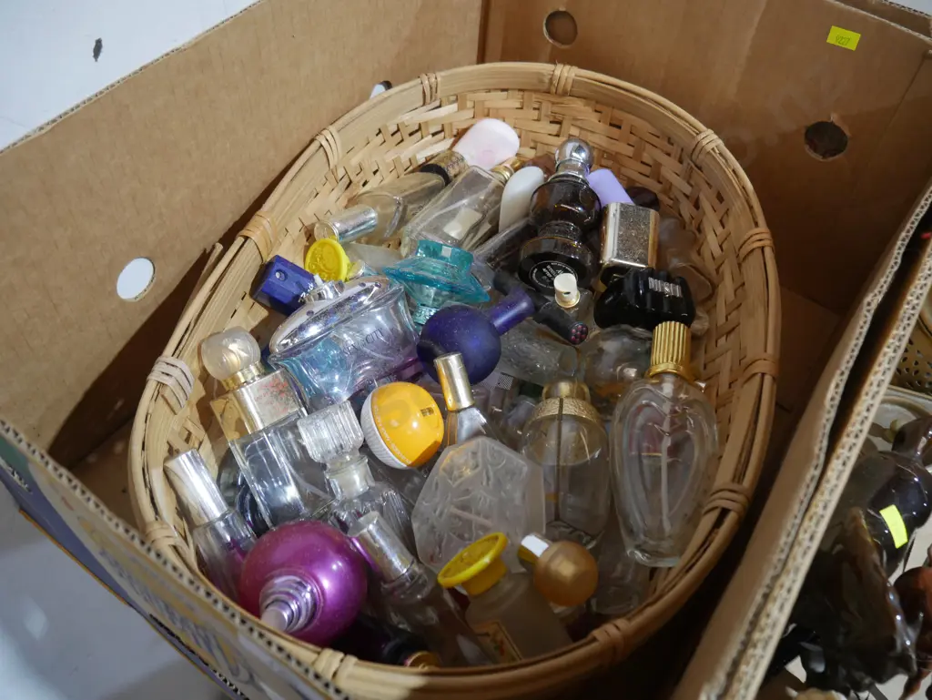 Perfume bottles in cane basket Image 1++