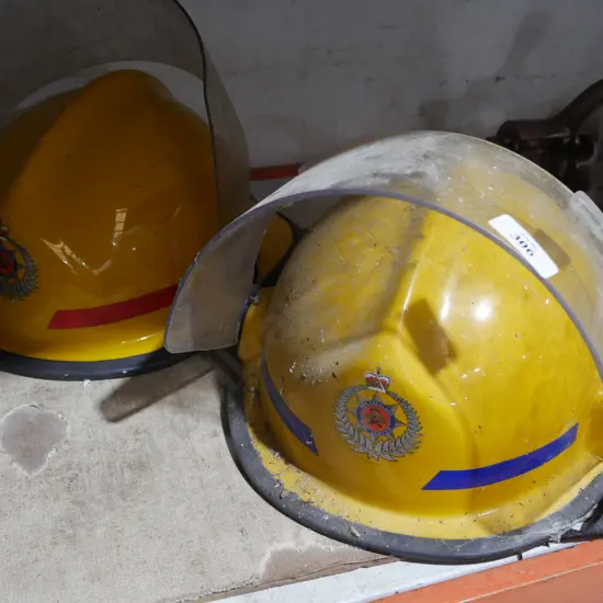 2 NZ fire service helmets