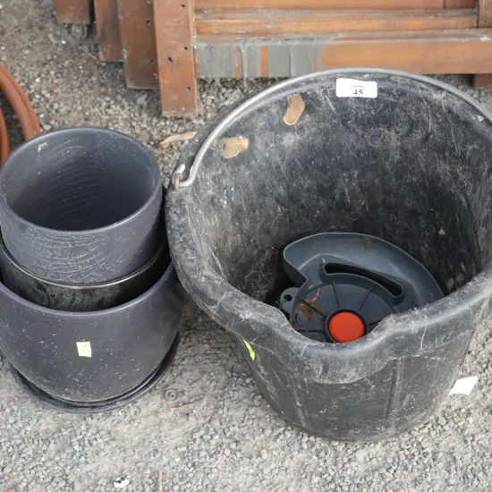 Black plant pots and bucket