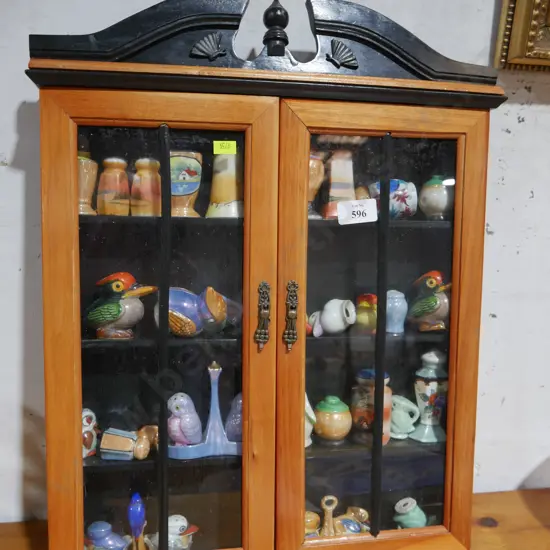 Assorted salt and pepper shakers in display case