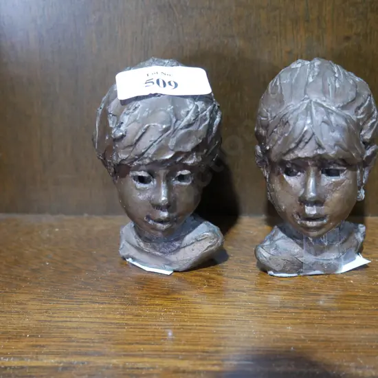 Two Ken Kendall head sculptures