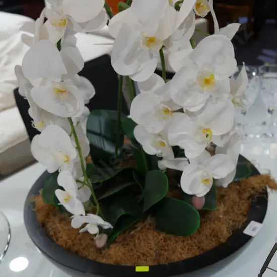 Artificial flower in bowl