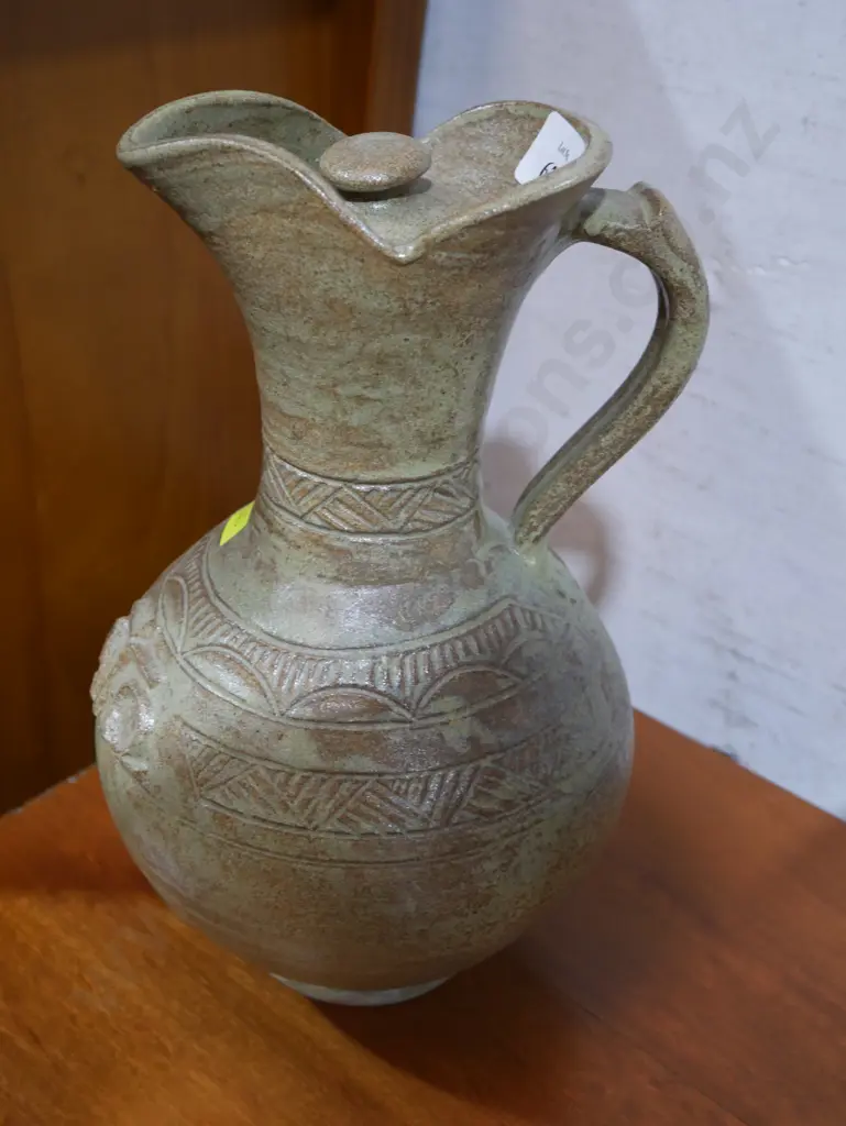 Pottery lidded jug Image 1++