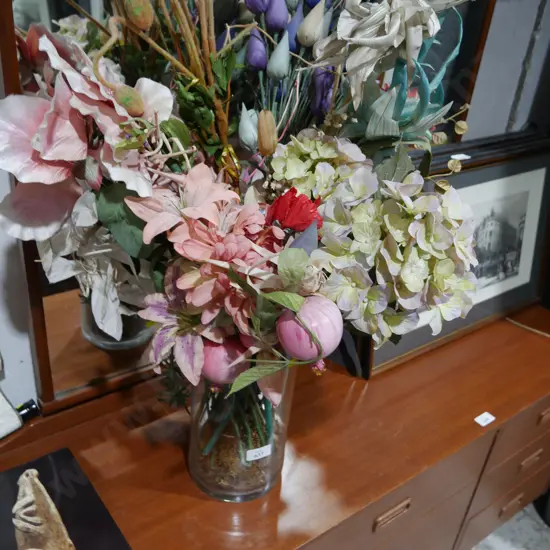Artificial plants in glass vase