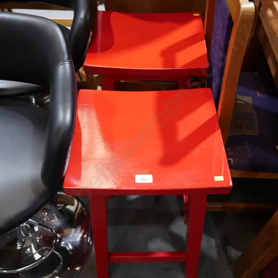Two red bar stools