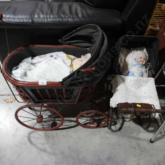 2 dolls in prams