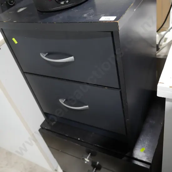 Two sets of bedside drawers