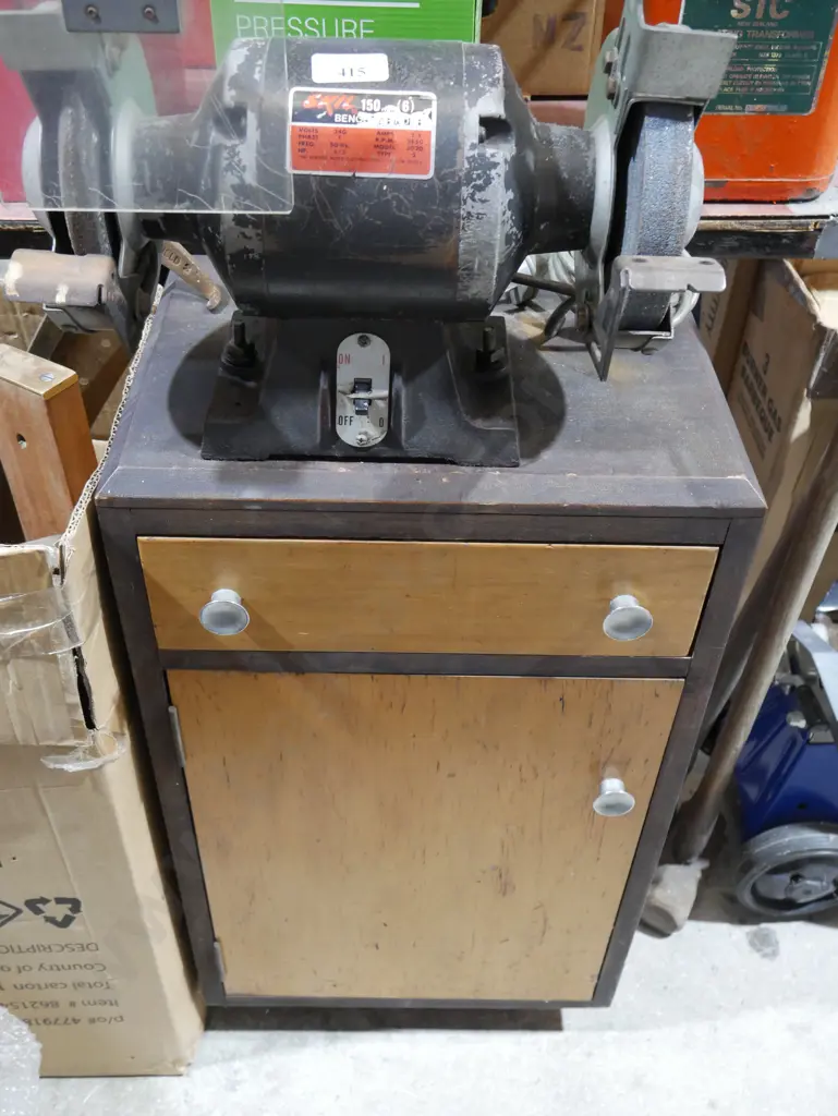 Skil bench grinder on cupboard Image 1++