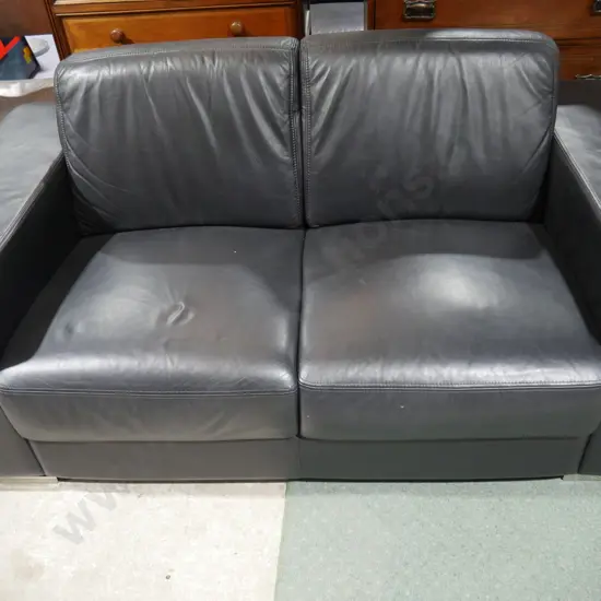 Two-piece black leather lounge suite
