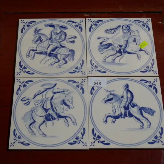 Four blue and white tiles
