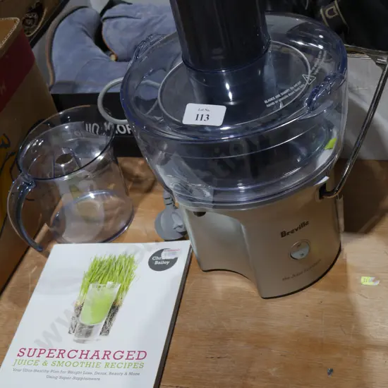 Breville  juicer and book