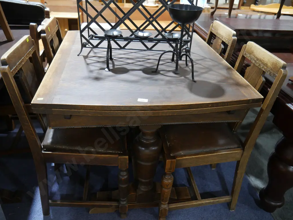 Oak draw leaf table and four chairs Image 1++