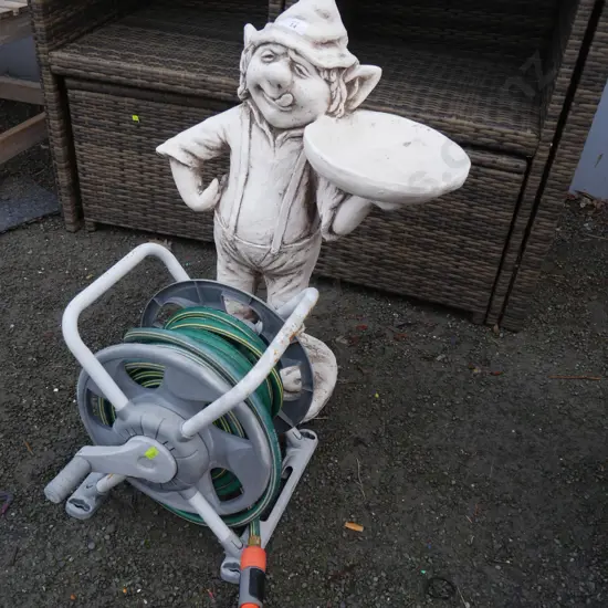 Hose reel and gnome bird bath