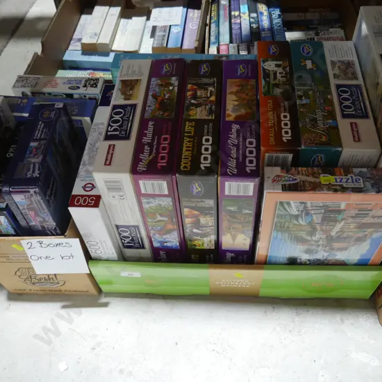 2 boxes of jigsaw puzzles