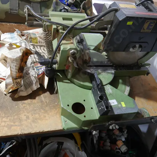 Sliding compound mitre saw, table and roller conveyors